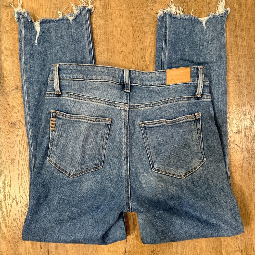 PAIGE Medium Blue Boot Cut Jeans with Frayed Hem